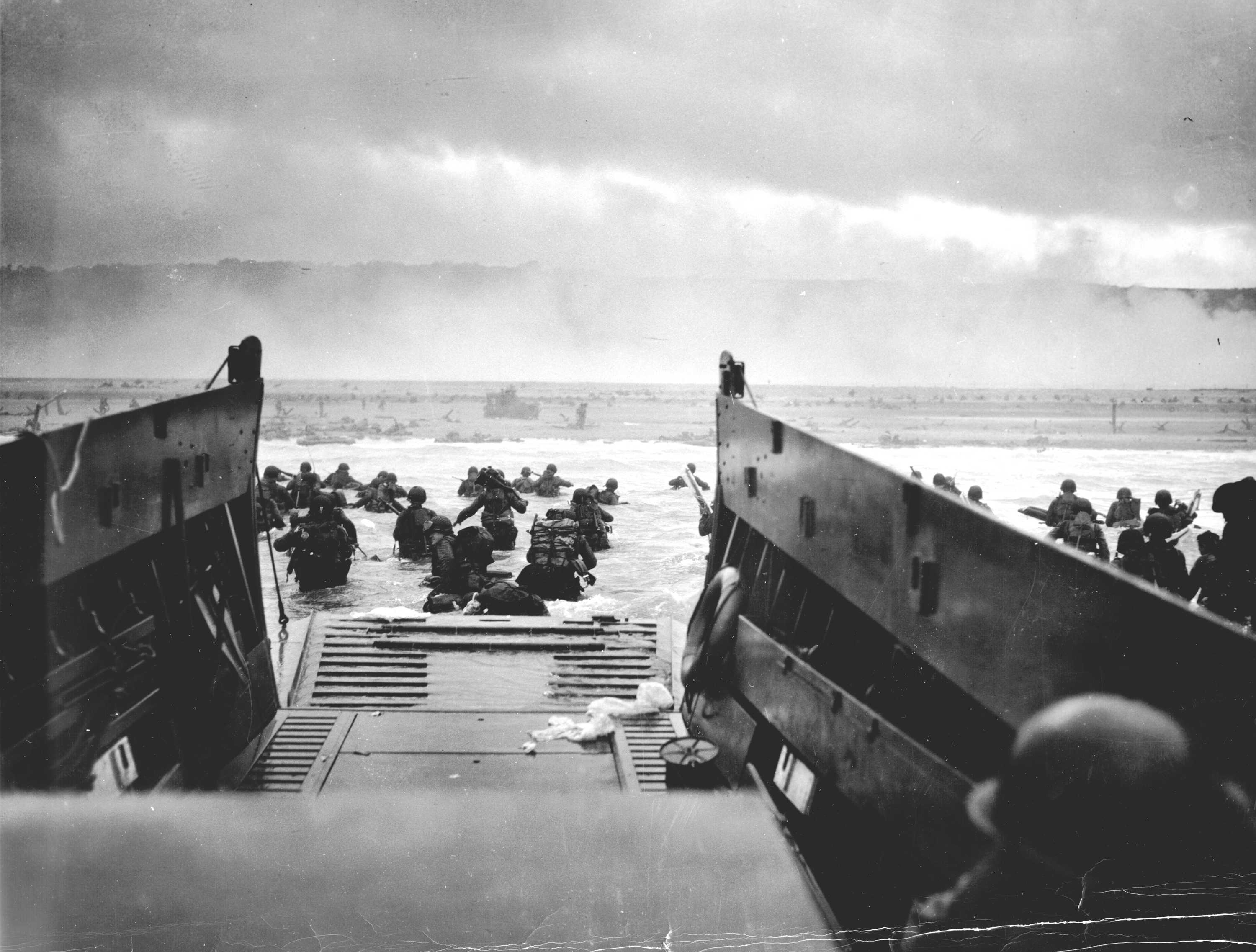 A Coast Guard-manned LCVP from the U.S.S. Samuel Chase disembarks troops of the First Division on the morning of 6 June 1944 at Omaha Beach A Coast Guard-manned LCVP from the U.S.S. Samuel Chase disembarks troops of the First Division on the morning of 6 June 1944 at Omaha Beach